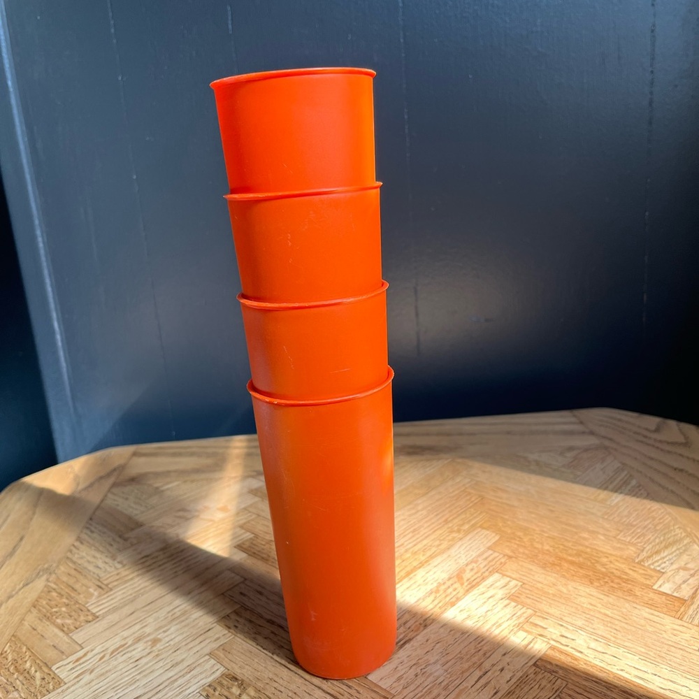 Set of 4 tall Tupperware tumblers in orange